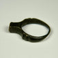 Roman bronze signet ring dating circa 100–300 CE with worn bezel and natural green-black patina