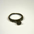 Imperial Roman bronze finger ring featuring a smooth worn bezel and rounded cast band