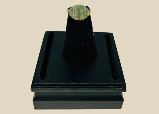 Imperial Roman bronze ring, circa 2nd–4th century AD, featuring incised linear decoration across its bezel; aged patina with green oxidation and surface wear from centuries of burial, historically used as both personal adornment and symbolic status marker within Roman society.