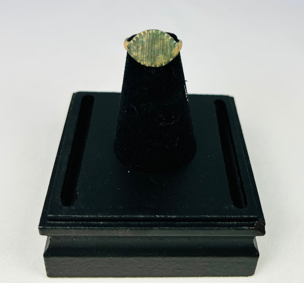 Museum-style photo of an authentic Imperial Roman bronze ring