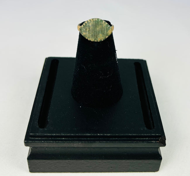 Museum-style photo of an authentic Imperial Roman bronze ring