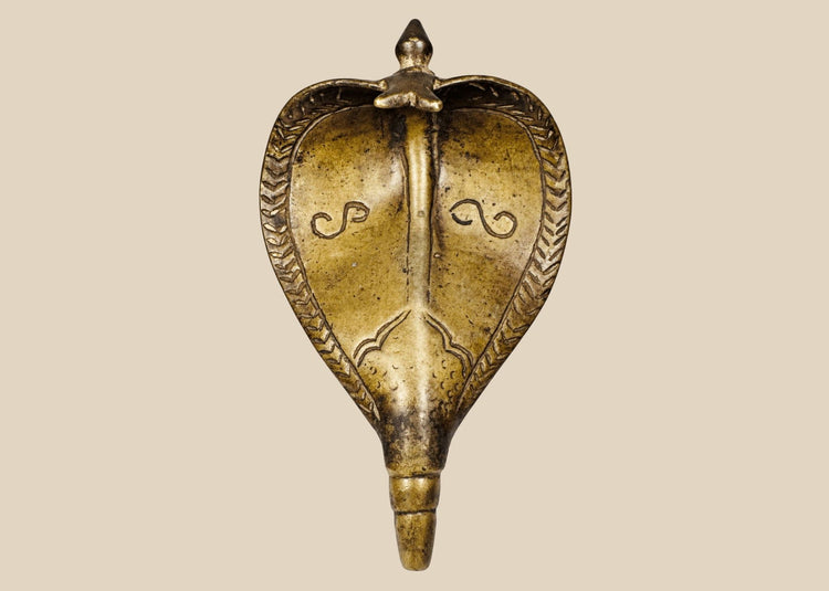 Antique 19th century Indian brass Naga cobra shrine canopy with expanded hood and aged patina.
