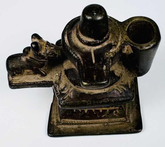 Antique Indian brass Shiva Lingam shrine with Nandi figure and stepped architectural pedestal.