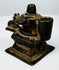 Indian Shaivite devotional object in cast brass with central Shiva Lingam and reclining Nandi bull.