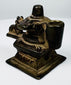 Indian Shaivite devotional object in cast brass with central Shiva Lingam and reclining Nandi bull.