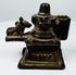 19th century cast brass Shiva shrine from India featuring Lingam, Nandi, and decorative stepped base.