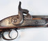 Indo-Afghan martial pistol with iron barrel, engraved lockwork, and brass reinforcement