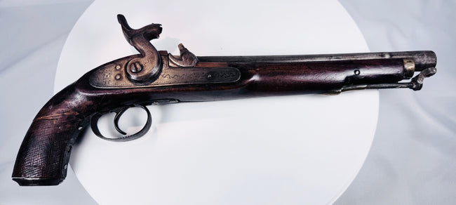 Nineteenth-century Afghan frontier pistol with weathered hardwood stock and original metal fittings
