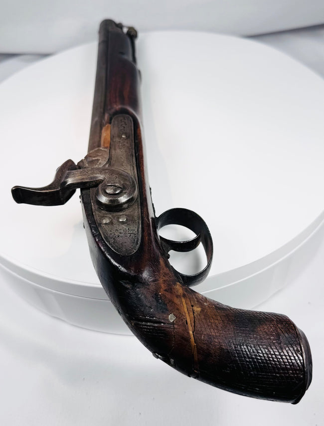 Afghan percussion firearm with engraved hammer, brass fittings, and aged patina
