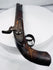 Afghan percussion firearm with engraved hammer, brass fittings, and aged patina
