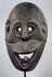 West Timor ceremonial mask hand-carved from hardwood with expressive simian features and aged patina.