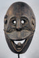 West Timor ceremonial mask hand-carved from hardwood with expressive simian features and aged patina.