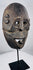 Historic Indonesian ceremonial mask from Fatuleu Village exhibiting distinctive carved facial features and natural aged wear.