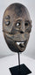 Historic Indonesian ceremonial mask from Fatuleu Village exhibiting distinctive carved facial features and natural aged wear.