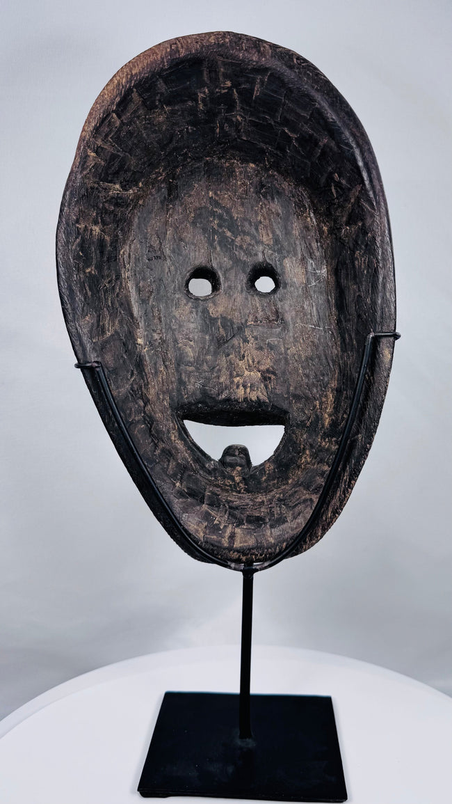 West Timor ancestral ritual mask showcasing hand-tool carving marks and early twentieth-century craftsmanship.