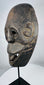 Atoni-associated ceremonial mask from West Timor featuring stylized facial features and rich age-related patina.