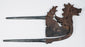 Antique dragon-lion areca nut cutter from Indonesia with incised ornament and silver-covered handles