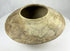Ancient Harappan terracotta bowl showing stylized fish imagery and slip-painted decoration.