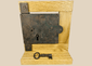 Antique 19th century iron rim lock with original skeleton key on display