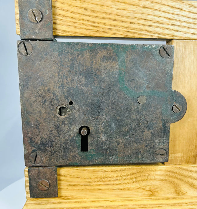 Vintage door rim lock mechanism with original iron key and hardware