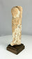 Iron Age Levantine terracotta fertility goddess figurine on wooden base.