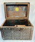 Heavy wrought-iron strongbox with brass plaque reading “Año 1840,” decorative studs, and signs of extensive working life use