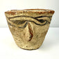 Three-quarter view of 12th century CE decorated pottery vessel