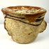 Profile of weathered antique mortar with rolled rim and lugs