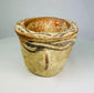 Side profile showing the rounded form of an Islamic terracotta mortar
