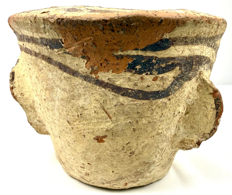 Side view of antique ceramic mortar with exterior lug handle