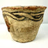 Medieval Afghan earthenware mortar with black painted slip designs encircling the upper rim and distinctive side protrusions.