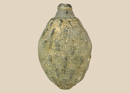 Medieval Islamic ceramic hand grenade from Greater Persia, 10th–12th century CE, bulbous body with narrow neck and textured surface, used for incendiary purposes