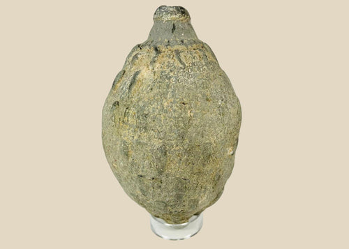 Medieval Islamic ceramic hand grenade from Greater Persia, 10th–12th century CE, bulbous body with narrow neck and textured surface, used for incendiary purposes
