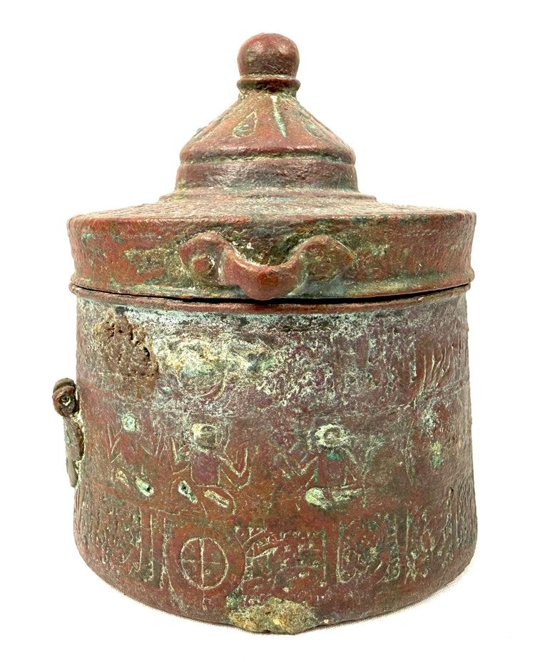 Medieval Islamic Khorassan bronze inkwell featuring intricate engraved floral and geometric motifs, circa 10th–12th century CE.
