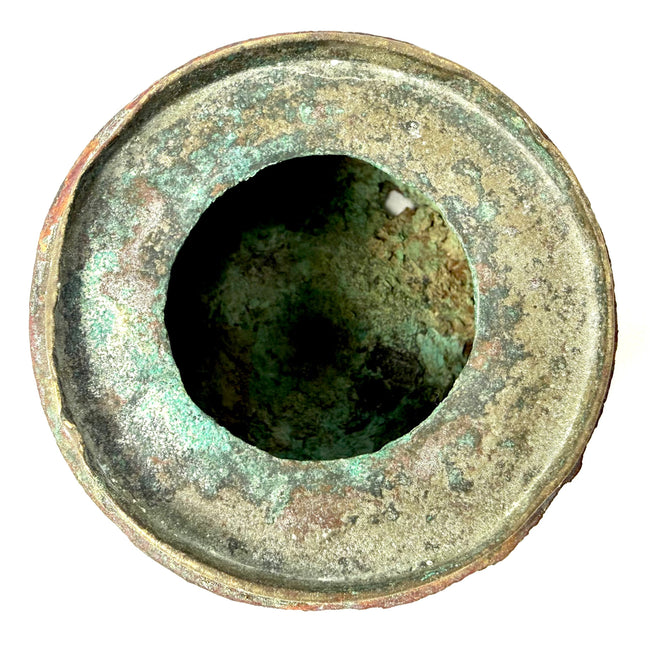 Medieval Islamic bronze inkwell featuring a removable domed lid and engraved ornamentation characteristic of 10th–12th century Khorassan craftsmanship.