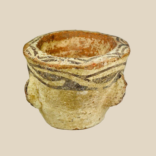 Islamic Era Afghan decorated pottery mortar, circa 12th century AD, with painted geometric designs and weathered earthen surface.