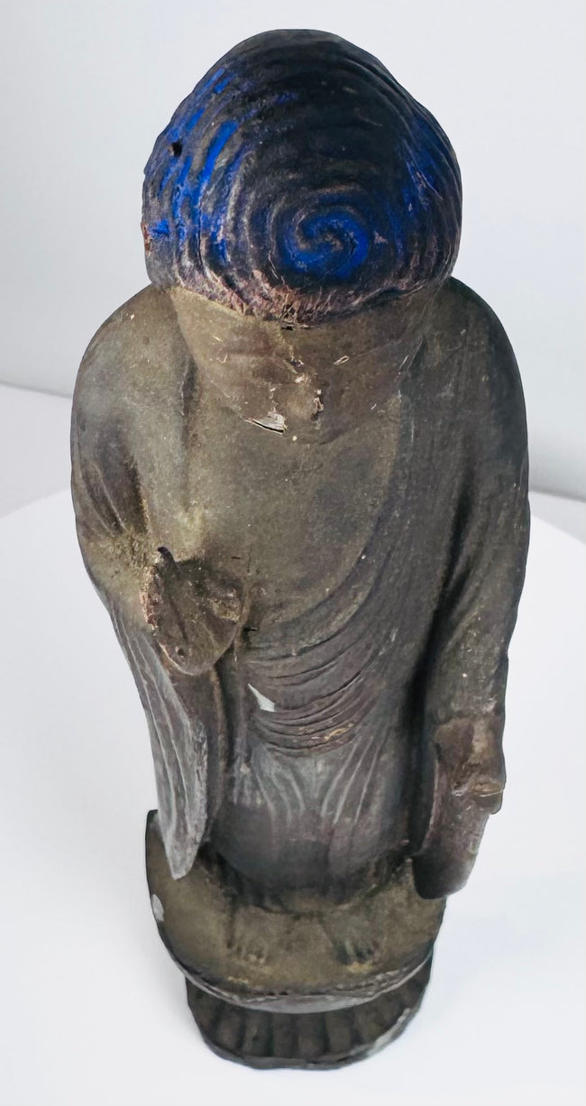 Close elevated view of the Amida Buddha’s blue hair, ushnisha, and worn gilding