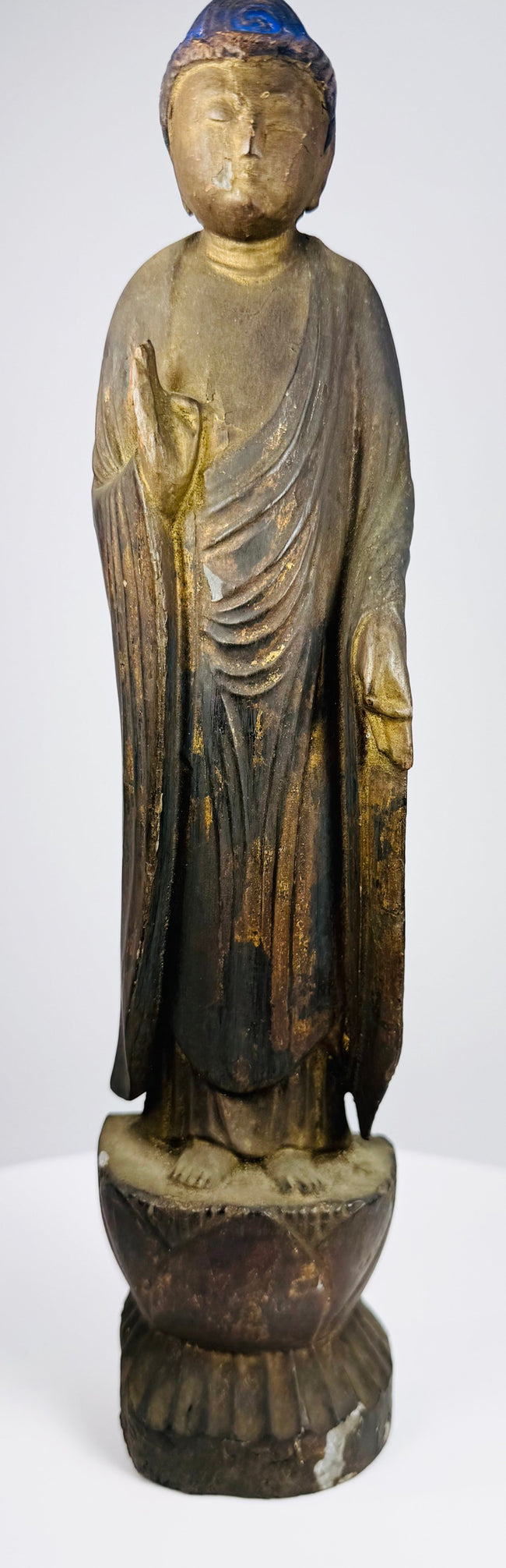 Three-quarter view of the carved wood Amitabha Buddha on a double-lotus pedestal