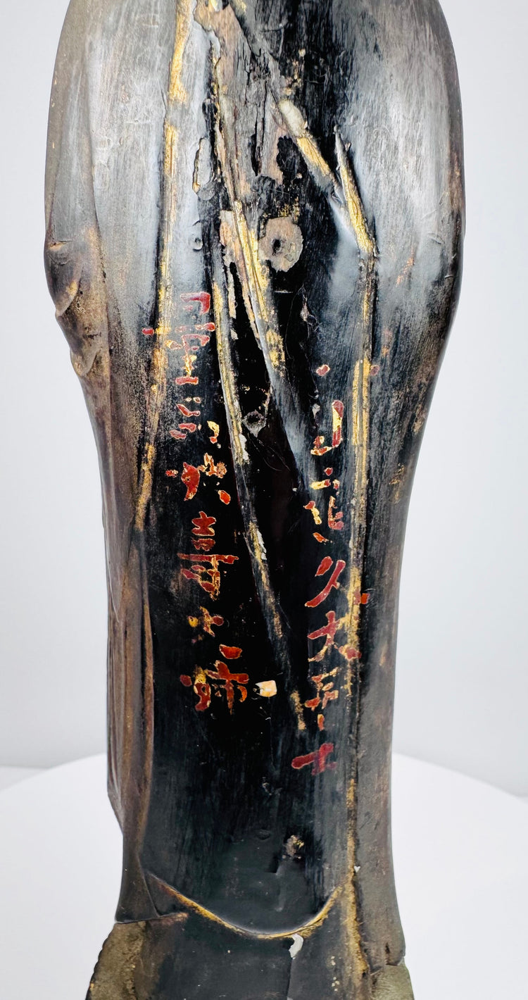 Reverse of the Japanese Amida Nyorai statue showing a red-and-gold inscription