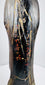 Reverse of the Japanese Amida Nyorai statue showing a red-and-gold inscription