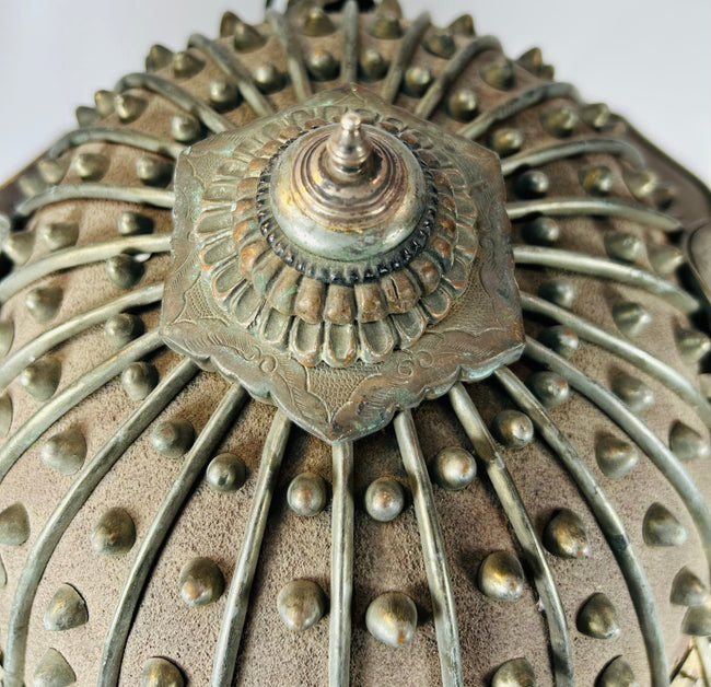Traditional Japanese hikeshi helmet with ribbed iron construction and finial