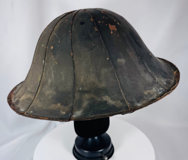 Japanese samurai ceremonial helmet with broad brim and black lacquered architectural form