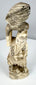 Antique Japanese okimono showing openwork spaces between the falconer and raptor