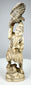 Three-quarter view of an antique Japanese falconer sculpture with spread-wing bird