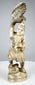 Meiji-era Japanese carved falconer holding an eagle or hawk overhead