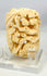Small Japanese Meiji-era bone carving with detailed birds and natural floral motifs