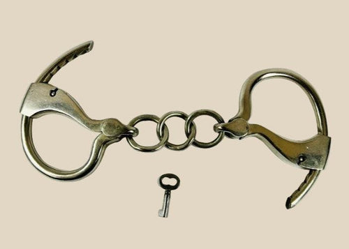 Pair of authentic John J. Tower patented adjustable handcuffs from the United States, late 19th to early 20th century (circa 1866–1940s), made of iron and steel, fully functional with original key, showing period patina and wear, representative of historic law enforcement restraint technology