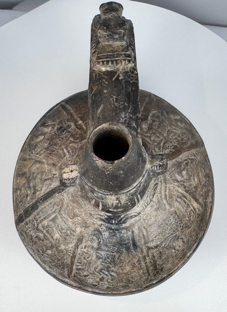 Pre-Columbian Peruvian blackware bottle associated with the Sicán culture of the Lambayeque Valley.