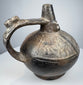 Pre-Columbian Sicán ritual vessel with compact rounded form and naturally aged burnished black surface.