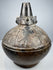 Sicán Naymlap ceramic vessel from Peru showing dark polished blackware and centuries-old surface wear.